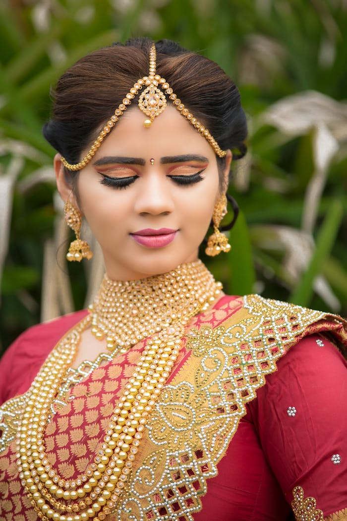 services-01 Beautiful Indian bride in embellished traditional attire during a photoshoot.